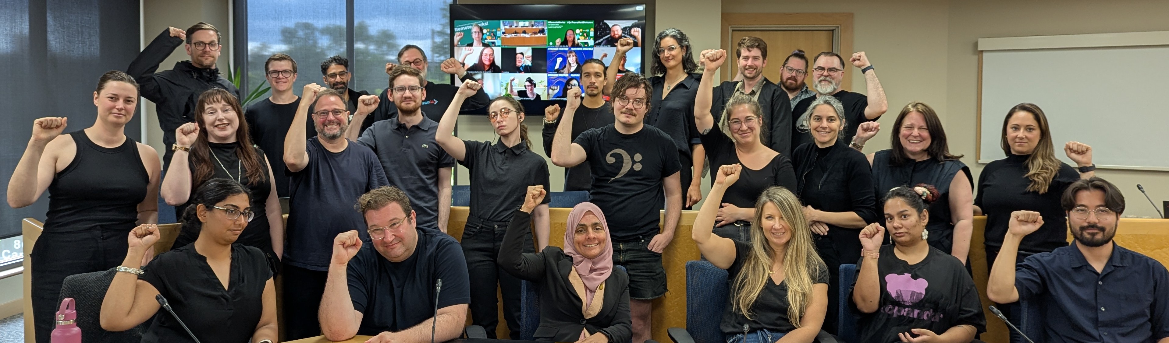 group photo of EC collective bargaining committee in black in solidarity with PSAC workers on strike
